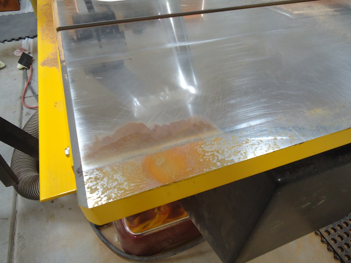 Paste wax application to cast iron saw table